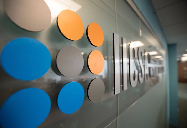 A logo on a wall with the acronym 'IICSA'