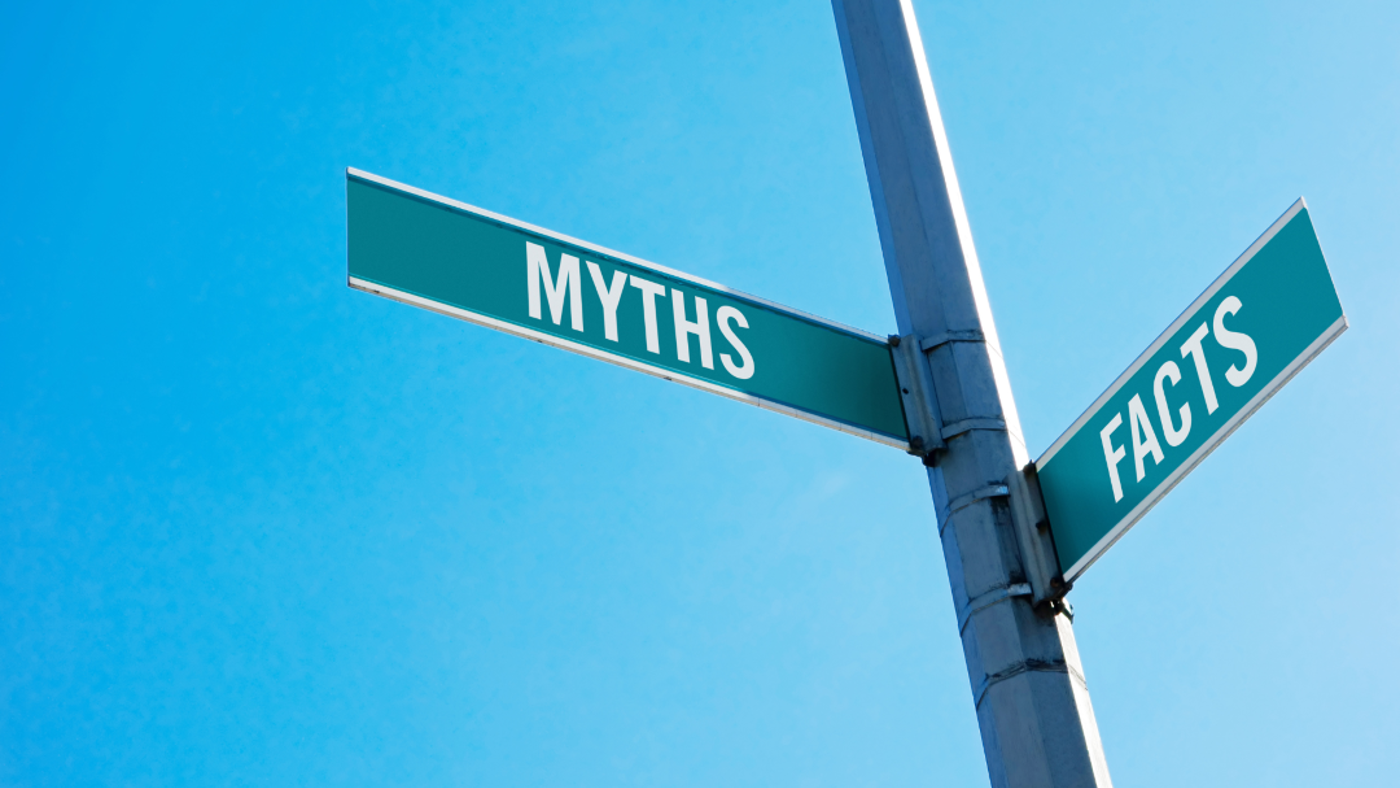 Road sign with the word myths pointing to the left and the word facts pointing to the right