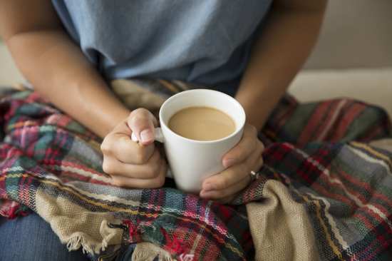 A woman holding a coffee cup