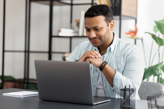 Person sitting in front of a laptop