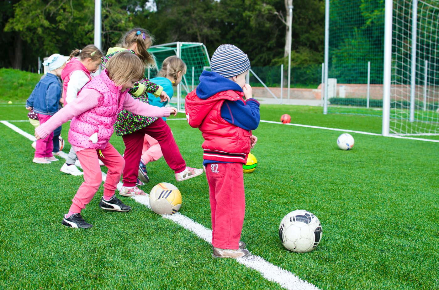 Young children playing football