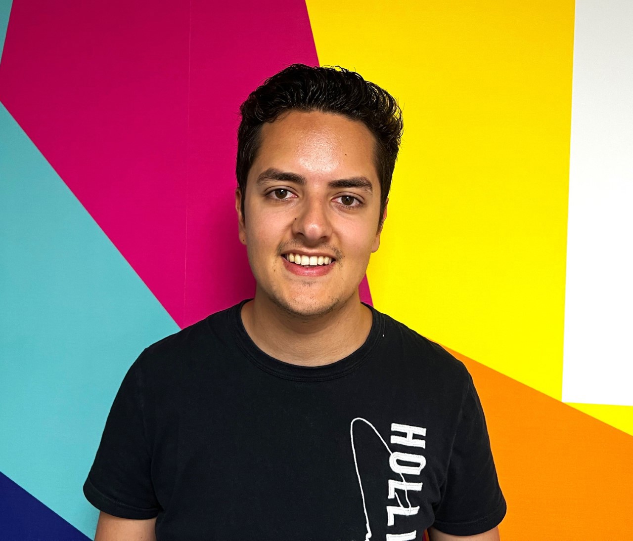 Headshot of Adam Graver in front of the Thirtyone:eight logo