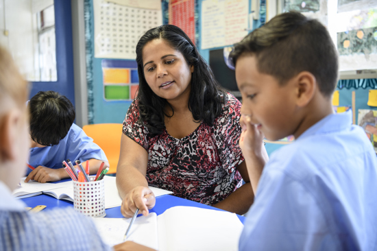 Teacher helping a student